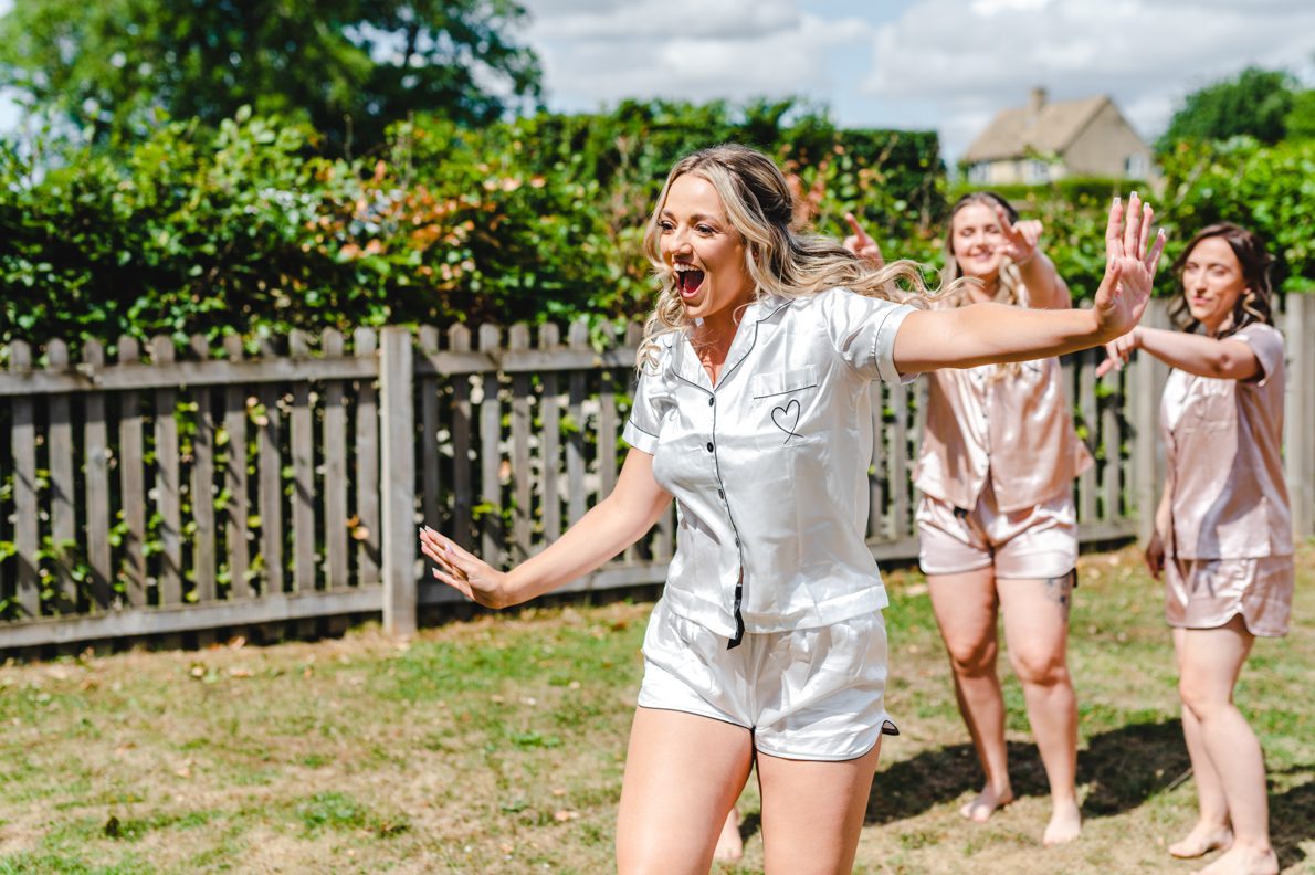 a bride dancing before getting ready on her wedding day